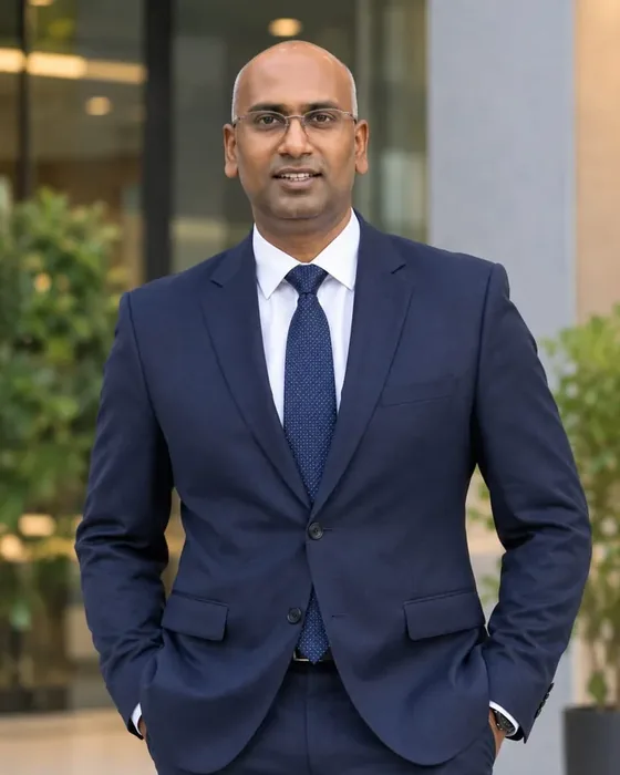Professional portrait of C. Rajesh Reddy, TrimHub NRI franchise investor based in Kuwait